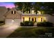 Charming two-story home featuring a brick and siding exterior, a two-car garage, and a welcoming covered front porch at 20827 Brinkley St, Cornelius, NC 28031