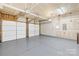 Spacious unfinished garage with two doors and ample room for parking and storage at 20827 Brinkley St, Cornelius, NC 28031