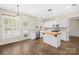 Bright kitchen with stainless steel appliances, wooden island, and hardwood floors at 20827 Brinkley St, Cornelius, NC 28031