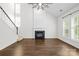 Spacious living room featuring a fireplace, natural light, and hardwood flooring at 20827 Brinkley St, Cornelius, NC 28031