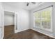 Bright office space features wood floors, neutral walls, and a large window providing natural light at 20827 Brinkley St, Cornelius, NC 28031