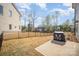 Large fenced backyard with a concrete patio, grill and a view of the surrounding neighborhood at 2105 Moss Bluff Dr, Mint Hill, NC 28227