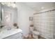 Bright bathroom with a modern vanity, decorative accents, and neutral decor at 2105 Moss Bluff Dr, Mint Hill, NC 28227