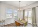 Cozy dining space with a sliding glass door leading to the backyard at 2105 Moss Bluff Dr, Mint Hill, NC 28227