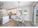 Bright dining area with a modern chandelier and a view of the kitchen at 2105 Moss Bluff Dr, Mint Hill, NC 28227