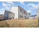 A home's exterior backyard view shows the siding and patio with a grassy area at 2105 Moss Bluff Dr, Mint Hill, NC 28227
