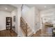Inviting foyer with a staircase featuring wood and metal railings at 2105 Moss Bluff Dr, Mint Hill, NC 28227