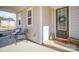 Cozy front porch with seating and a welcoming wreath on the front door at 2105 Moss Bluff Dr, Mint Hill, NC 28227
