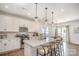 Bright kitchen boasts an island with bar seating, stainless steel appliances, and ample cabinet space at 2105 Moss Bluff Dr, Mint Hill, NC 28227