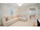 Well-lit living area featuring a comfortable sectional sofa, plush carpeting, and community views at 2105 Moss Bluff Dr, Mint Hill, NC 28227