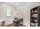 Bright home office with a desk, chair, and built-in shelving for storage at 2105 Moss Bluff Dr, Mint Hill, NC 28227