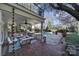 Relaxing back patio with overhead fans, spiral staircase, and a beautiful view of the pool at 2132 Rolston Dr, Charlotte, NC 28207