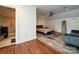Open bedroom layout features a seating area, hardwood floors, and neutral walls for a relaxing ambiance at 2132 Rolston Dr, Charlotte, NC 28207