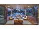 Gorgeous covered patio with ceiling fans and elegant outdoor seating overlooks the pool at 2132 Rolston Dr, Charlotte, NC 28207