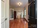 Bright foyer with hardwood floors and detailed trim, showcasing a welcoming entrance at 2132 Rolston Dr, Charlotte, NC 28207