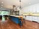 Open kitchen boasts a large center island, stainless appliances, and modern finishes at 2132 Rolston Dr, Charlotte, NC 28207