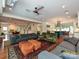 Open-concept living area with hardwood floors, a ceiling fan, and plenty of natural light at 2132 Rolston Dr, Charlotte, NC 28207