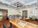 Spacious living room boasting coffered ceilings, hardwood floors, and comfortable seating at 2132 Rolston Dr, Charlotte, NC 28207