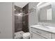 Modern bathroom features a tiled shower, vanity with marble top, and framed mirror at 22 Honeysuckle Ln, Clover, SC 29710
