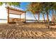 Lakeside beach featuring a wooden picnic table and covered area overlooking serene water at 22 Honeysuckle Ln, Clover, SC 29710