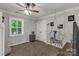 Bright bedroom with a hanging chair, fan, neutral walls, and plush carpeting at 22 Honeysuckle Ln, Clover, SC 29710