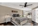 Serene bedroom with hardwood floors, a modern ceiling fan, and plenty of natural light from windows at 22 Honeysuckle Ln, Clover, SC 29710