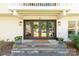 Inviting entryway with double doors, decorative wreaths, and potted plants at 22 Honeysuckle Ln, Clover, SC 29710