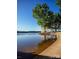 A tranquil lake view with calm waters and sandy shore, and a covered gazebo at 22 Honeysuckle Ln, Clover, SC 29710