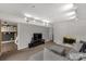 A well-lit living room features a white brick fireplace, comfortable gray sofa, and modern track lighting at 22 Honeysuckle Ln, Clover, SC 29710