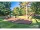 A fun playground with swings, slides, and play structures surrounded by green lawns at 22 Honeysuckle Ln, Clover, SC 29710