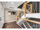 Elegant stairway with wood and metal railings leads to the upper level at 22 Honeysuckle Ln, Clover, SC 29710
