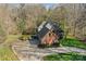 Beautiful aerial view of the brick home with driveway at 221 Colony Dr, Mooresville, NC 28115