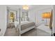 Bright bedroom with a four poster bed, neutral color palette, and plenty of natural light at 221 Colony Dr, Mooresville, NC 28115