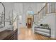 Bright foyer with high ceilings, hardwood floors, and a staircase with wood railing at 221 Colony Dr, Mooresville, NC 28115