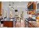 Open kitchen design with breakfast table and granite countertops plus stainless appliances at 221 Colony Dr, Mooresville, NC 28115