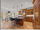 Spacious kitchen features wood cabinets, a center island with bar seating, stainless steel appliances, and an eat-in breakfast area at 221 Colony Dr, Mooresville, NC 28115