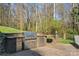 Well-equipped outdoor kitchen with stainless steel grill and appliances, perfect for entertaining at 221 Colony Dr, Mooresville, NC 28115
