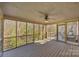 Relax on this spacious screened porch with wooden floors, views of a green and lush backyard at 221 Colony Dr, Mooresville, NC 28115