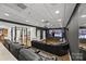 Spacious theater room with comfortable seating, home gym, and projector for an immersive viewing experience at 221 Colony Dr, Mooresville, NC 28115