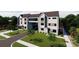 Modern townhome showcases sleek design, complemented by well-manicured landscaping, and convenient driveway access at 3012 Yada Ln, Charlotte, NC 28208