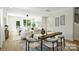 Bright living room features a comfortable seating area, modern decor, and seamless access to the kitchen at 3012 Yada Ln, Charlotte, NC 28208
