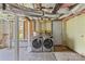 Unfinished basement laundry room featuring new washer and dryer at 306 7Th Sw St, Hickory, NC 28602