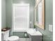 Well-lit half bathroom featuring modern fixtures, white sink, and large window at 306 7Th Sw St, Hickory, NC 28602