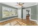 Bedroom with hardwood floors, multiple windows, and white trim throughout at 306 7Th Sw St, Hickory, NC 28602