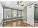 Bright bedroom with a ceiling fan, hardwood floors, and three large windows at 306 7Th Sw St, Hickory, NC 28602