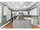 Modern kitchen featuring stainless steel appliances, white cabinets, and a functional center island at 306 7Th Sw St, Hickory, NC 28602
