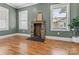 Cozy room with a decorative fireplace and natural light streaming through the windows at 306 7Th Sw St, Hickory, NC 28602
