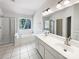 Bright bathroom features a soaking tub, double vanity, and walk-in shower at 3711 Cole Mill Rd, Charlotte, NC 28270