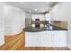 Modern kitchen features stainless steel appliances, granite counters, white cabinets, and an open layout for easy cooking at 3711 Cole Mill Rd, Charlotte, NC 28270