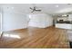 Open-concept living area features hardwood floors, white walls, and seamless transition to the kitchen for entertaining and Gathering time at 3711 Cole Mill Rd, Charlotte, NC 28270